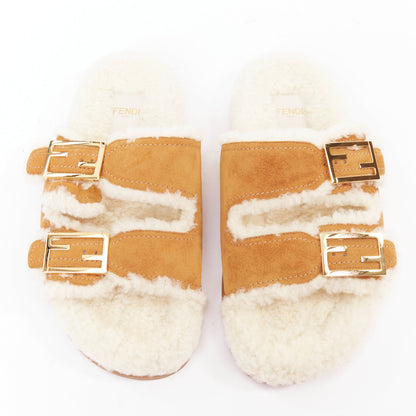 Women's Fendi Feel suede shearling gold FF buckle sandal slides