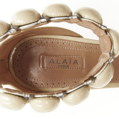 Women's Alaia La Bombe ball embellished studded patent sandal