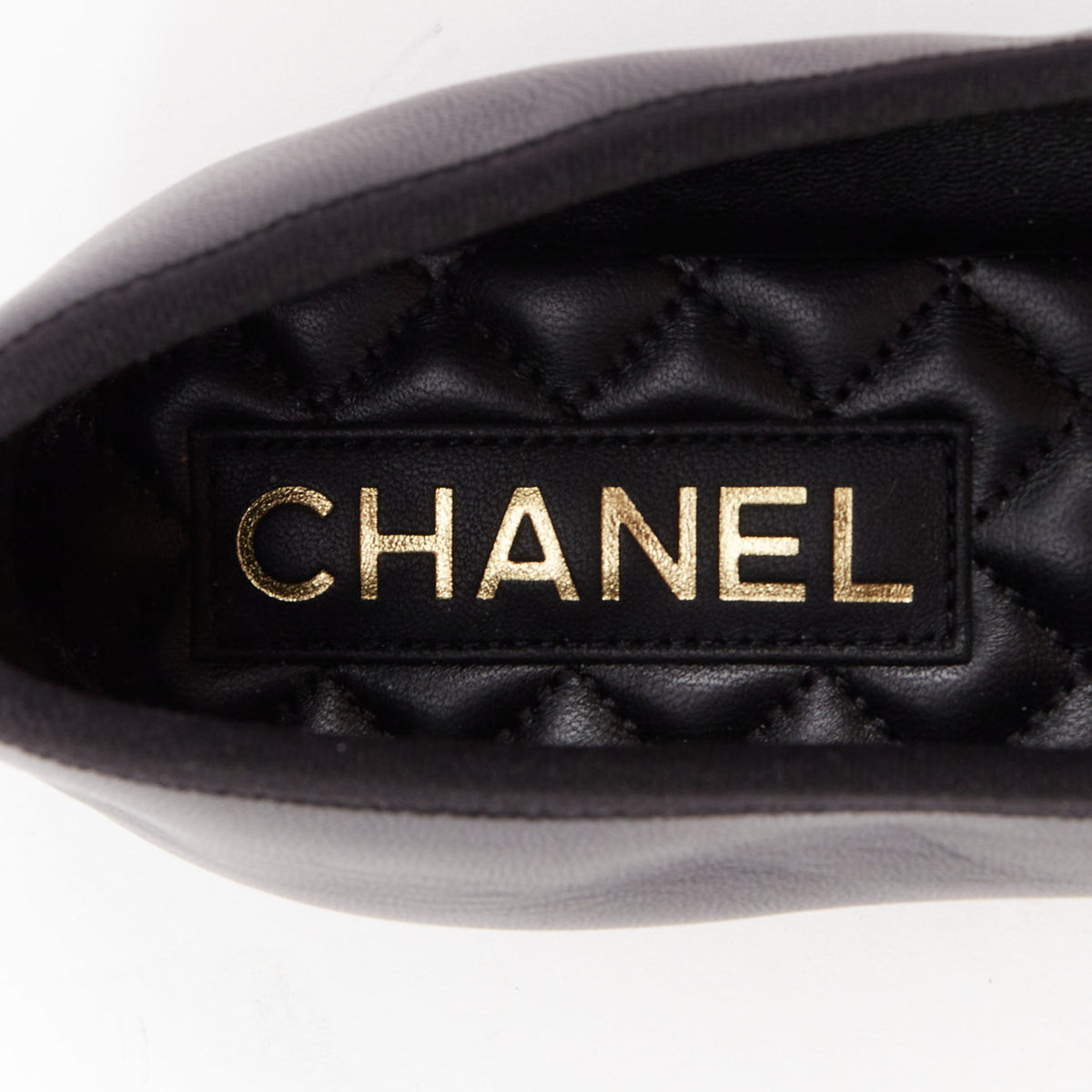 Women's Chanel black soft lambskin stitched CC cap toe flats