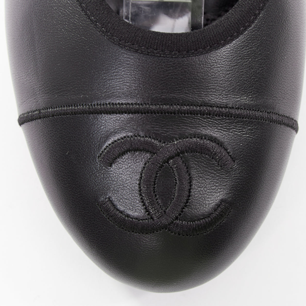 Women's Chanel black soft lambskin stitched CC cap toe flats