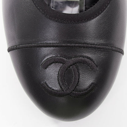 Women's Chanel black soft lambskin stitched CC cap toe flats