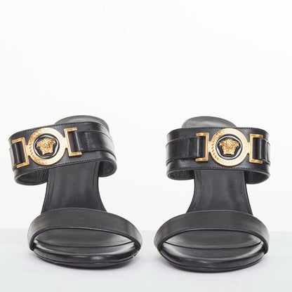 Women's Versace gold buckle black leather sandals