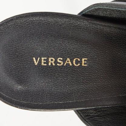 Women's Versace gold buckle black leather sandals