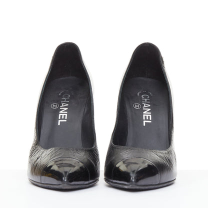 Women's Chanel Sculpted Sailor Knot black leather CC cap toe pumps