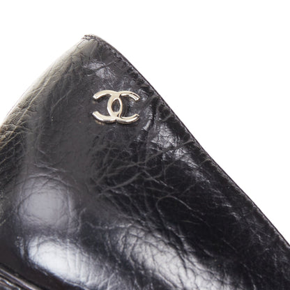 Women's Chanel Sculpted Sailor Knot black leather CC cap toe pumps