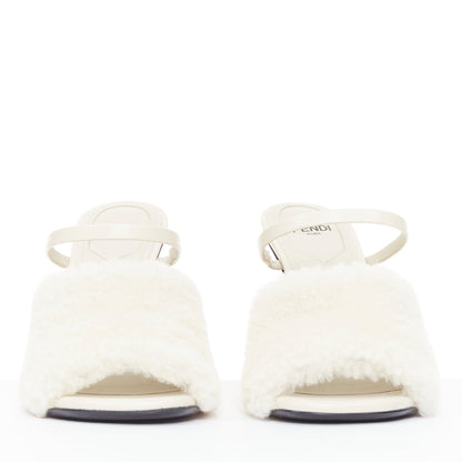 Women's Fendi First cream shearling gold F heel mule sandals