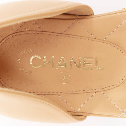 Women's Chanel nude quilted lambskin CC grosgrain cap toe pumps