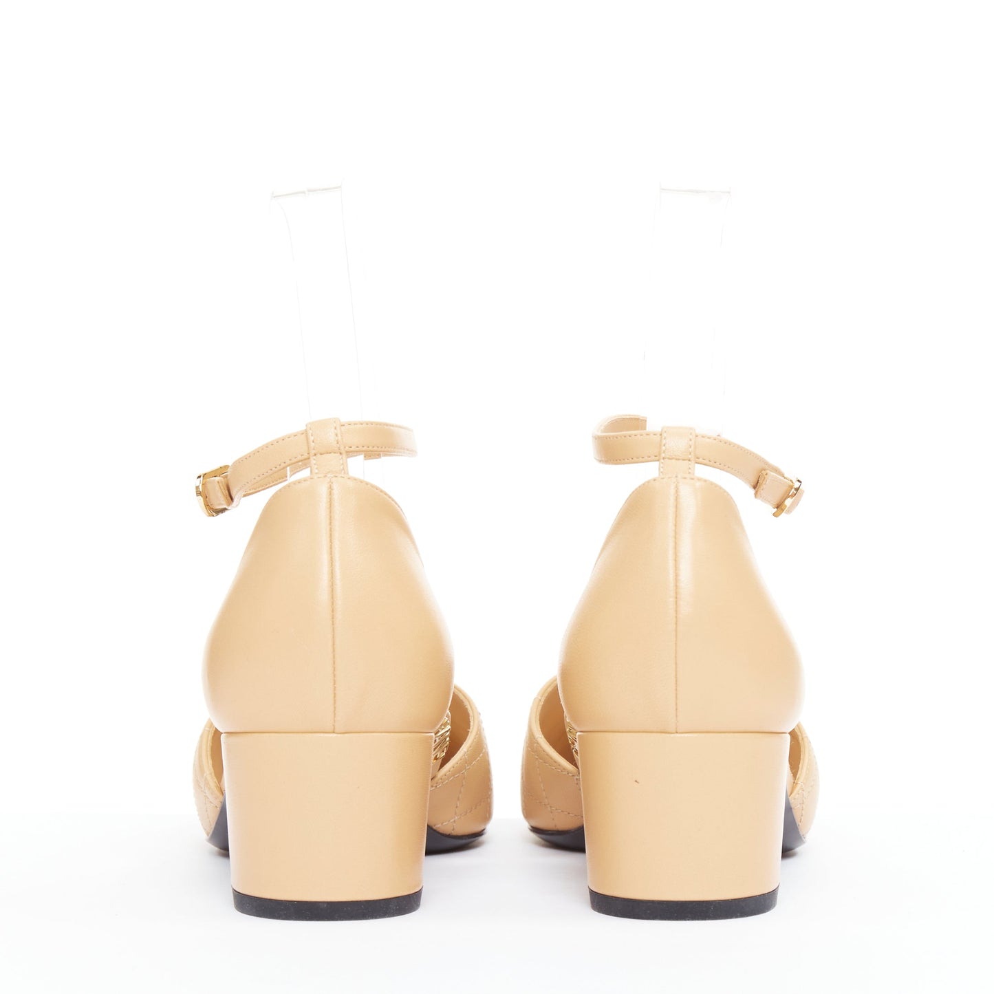 Women's Chanel nude quilted lambskin CC grosgrain cap toe pumps