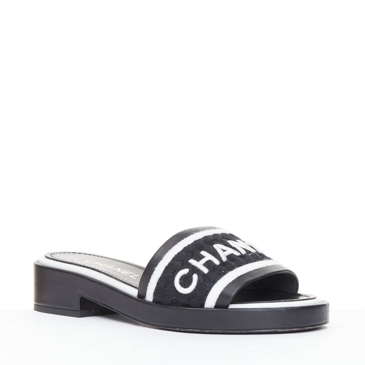 Women's Chanel black white logo embroidered lambskin heeled mules