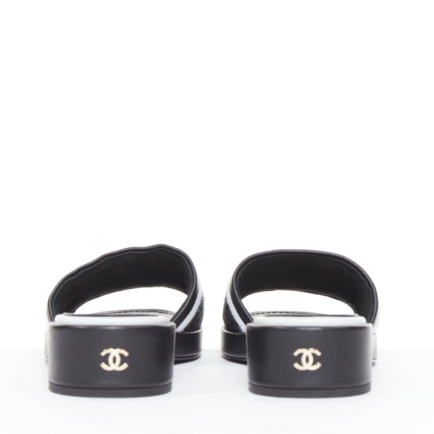 Women's Chanel black white logo embroidered lambskin heeled mules