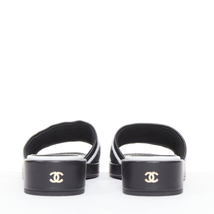 Women's Chanel black white logo embroidered lambskin heeled mules