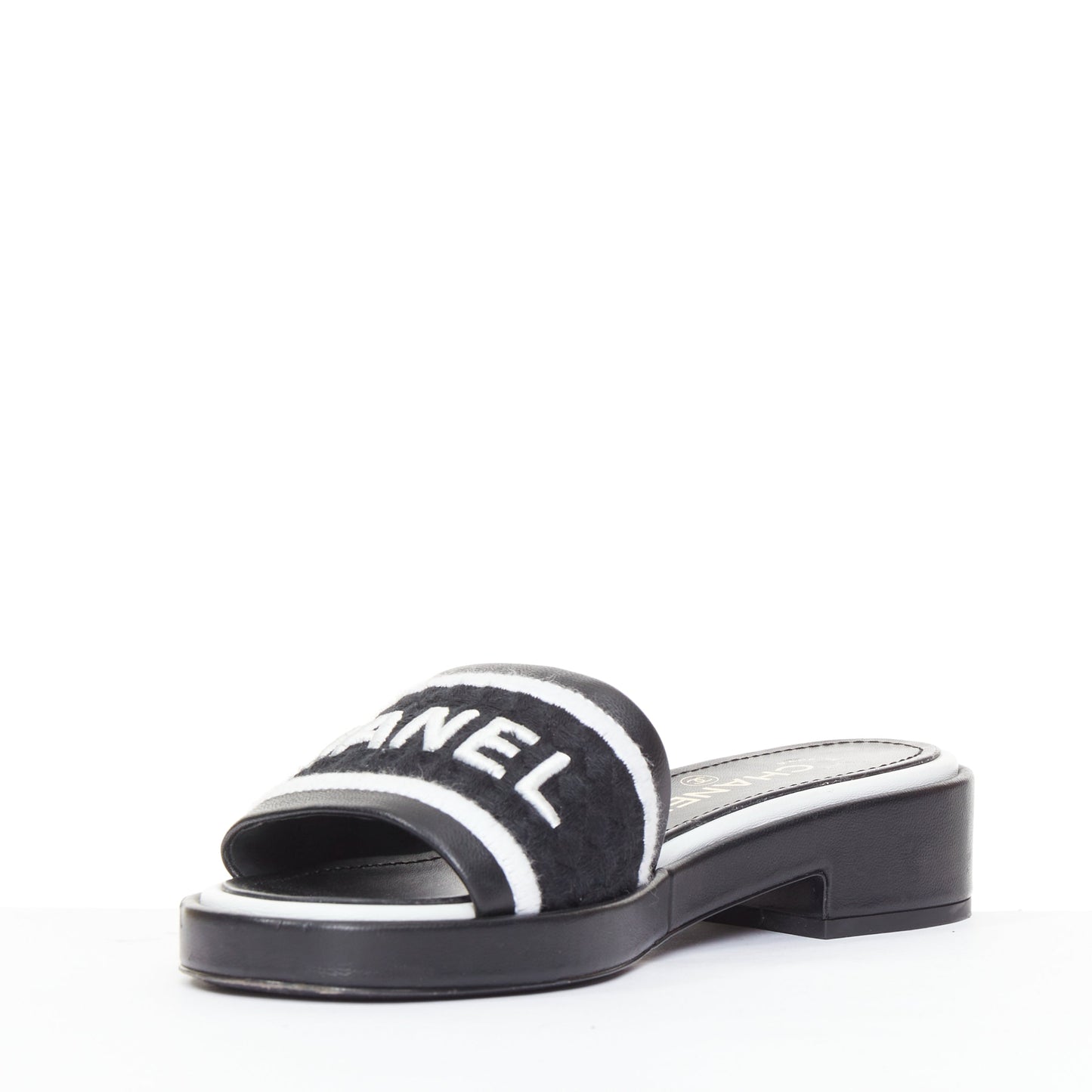 Women's Chanel black white logo embroidered lambskin heeled mules