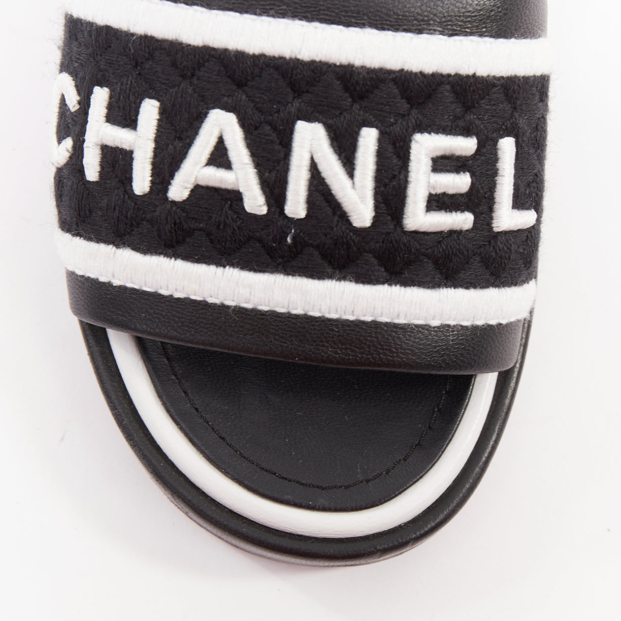 Women's Chanel black white logo embroidered lambskin heeled mules