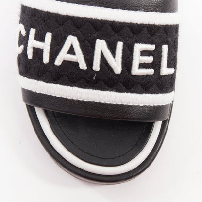 Women's Chanel black white logo embroidered lambskin heeled mules
