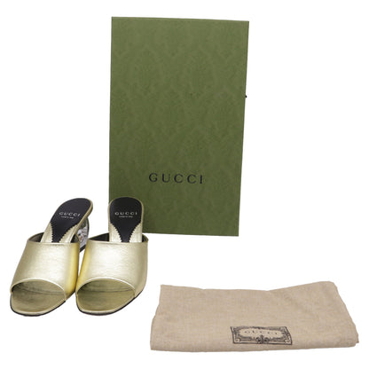 Women's  Gucci Bella Heeled Mules in Metallic Gold Leather